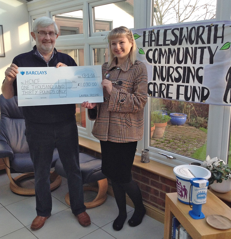Ted Edwards receiving a cheque from Lauren Friend