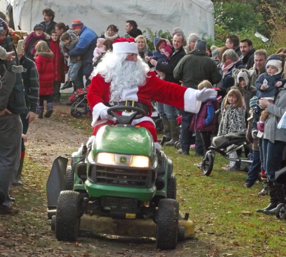father-christmas-arriving-on-his-lawnmower-fairhaven-garden