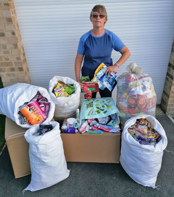 Susan Simpson and some of the items the community have dropped-off for recycling