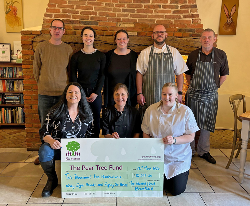 Staff at the Queen's Head at Bramfield are celebrating after smashing through an ambitious target to raise more than £10,000 for a much-loved local charity.